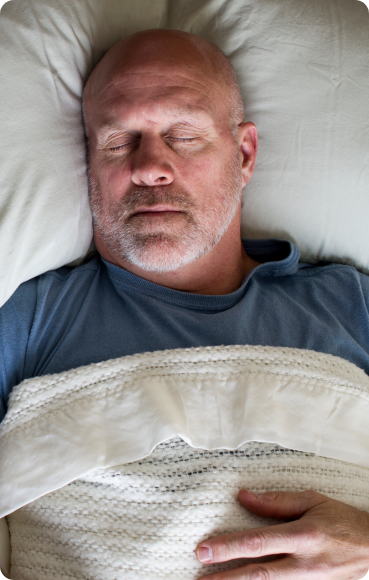 man-asleep-in-bed - at home sleep studies