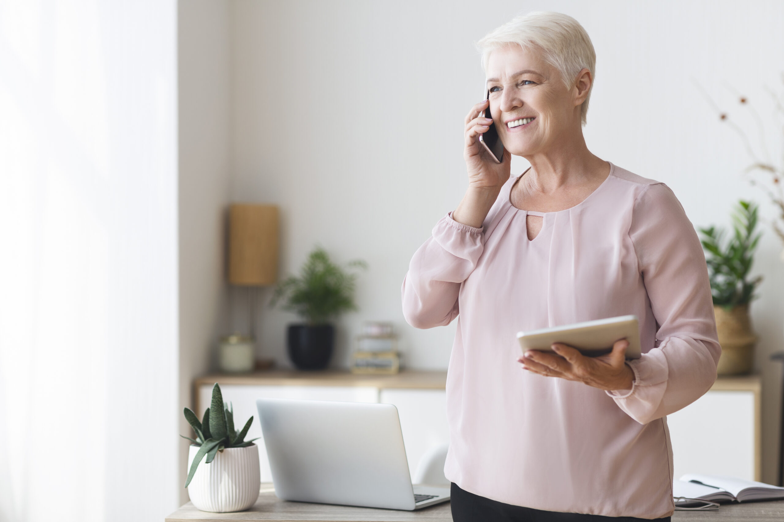 older woman speaking on phone to sleep consultant at home for a sleep solution