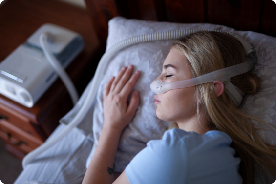 woman sleeping with CPAP machine -sleep solution outcomes
