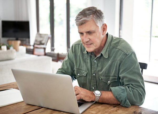 older man on computer at home